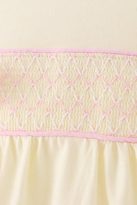Cream smocked bow bubble